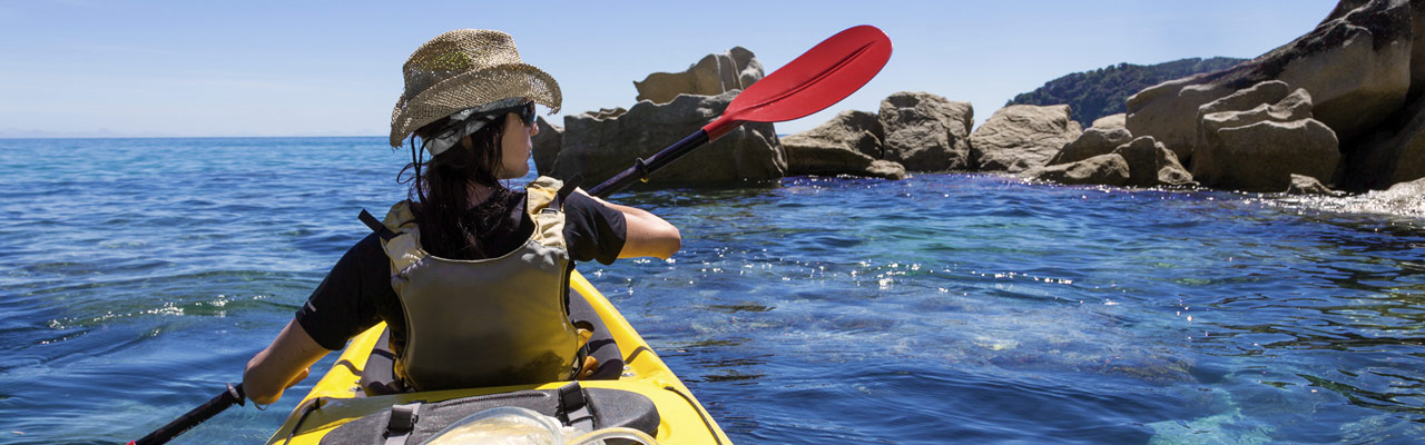 Exploring the Abel Tasman Park with a kayak.